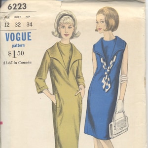 May include: A vintage sewing pattern for two dresses. The pattern is for Vogue Young Fashionables and is number 6223. The pattern is for sizes 12, 32, and 34. The dresses are shown on two models. One dress is a yellow-green color and the other is a blue color.