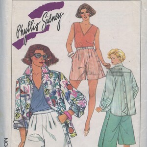 May include: Simplicity sewing pattern featuring three women wearing different outfits. The pattern is for a shirt and shorts. The pattern is by Phyllis Sidney.