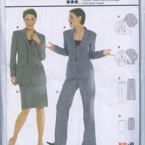 May include: A sewing pattern package featuring two women modeling business suits. The suits are gray, with options for a skirt or pants. The package includes the "Burda International" logo and the number "8262". The text on the package includes "All patterns with seam and hem allowances".