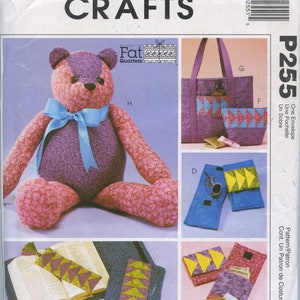 May include: A sewing pattern for a teddy bear, tote bag, and various pouches. The pattern is called "P255" and is from McCall's Crafts. The pattern uses "Fat Quarters" fabric.