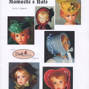 May include: A book titled "Mamzelle's Hats" by K.L. Epperly, featuring illustrations of dolls wearing various hats. The book is a "Doll Styles" publication.