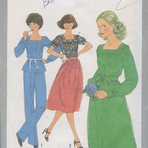 May include: A sewing pattern for a dress with three different styles. The pattern is Simplicity 8356, size 10 miss. The dress is shown in green, blue, and red.