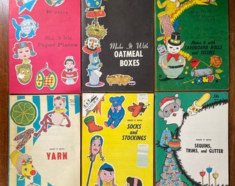 May include: Six vintage craft books with colorful covers featuring illustrations of various crafts. The titles include "Make It With Paper Plates", "Make It With Oatmeal Boxes", "Make It With Cardboard Rolls and Tissues", "Make It With Yarn", "Make It With Socks and Stockings", and "Make It With Sequins, Trims, and Glitter".