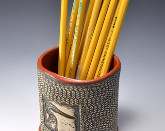 Oval Desktop Pencil and Pen holder in Paprika Red Glaze and Lively Textured Exterior with heron Image by Tom Bottman