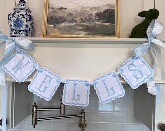 Baby blue embroidered name banner.