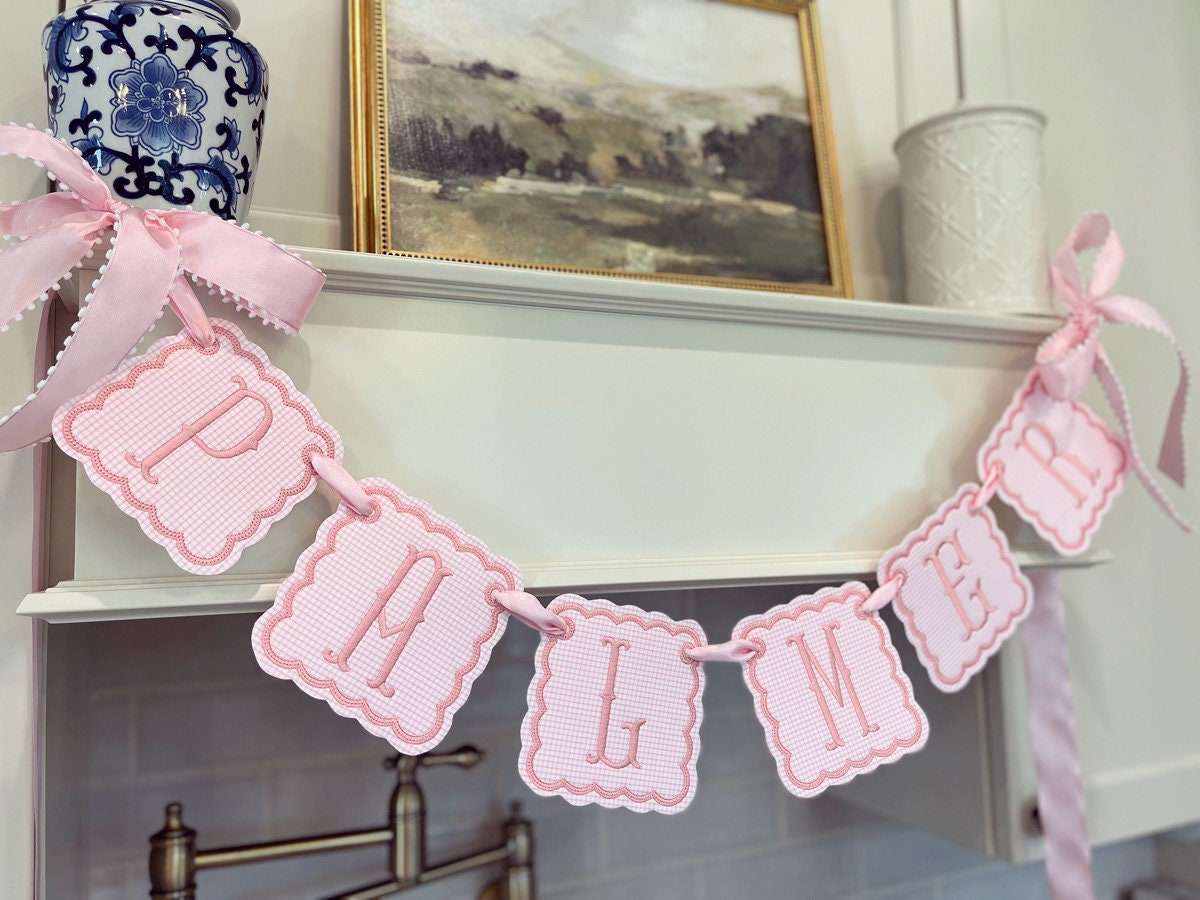 Baby pink gingham embroidered name banner.