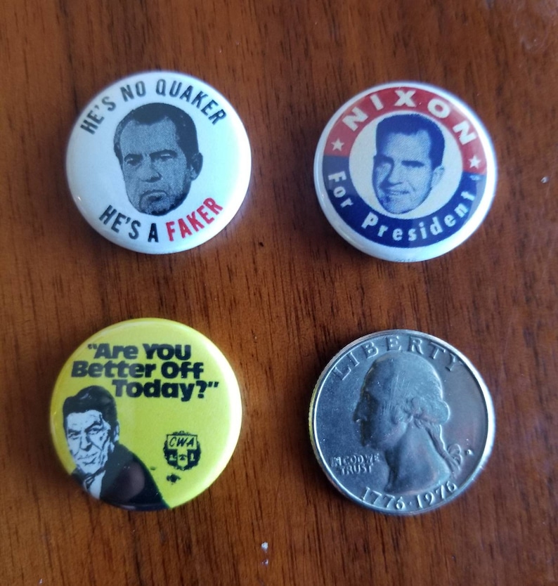 May include: Four political campaign buttons and a quarter. Two buttons feature Richard Nixon, one with "Nixon for President." Another button says "He's No Quaker, He's a Faker." A yellow button reads "Are You Better Off Today?" The quarter is dated 1976.