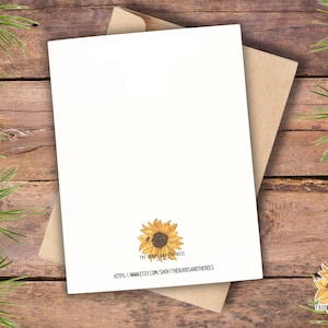 May include: A white greeting card with a brown kraft paper envelope. The bottom center of the card features a yellow sunflower illustration with a small bee, the text THE BURDS AND THE BEES EST 2021, and the URL HTTPS://WWW.ETSY.COM/SHOP/THEBURDSANDTHEBEES.