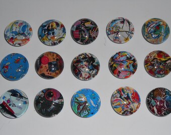 May include: Set of 15 round glass cabochons with colourful abstract art prints. The cabochons are approximately 1 inch in diameter and feature a variety of colours and patterns.