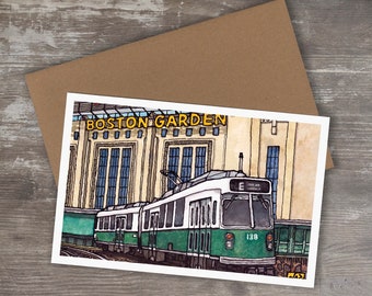 May include: A green and white train with the number 138 on the side is parked in front of a building with the words "Boston Garden" in yellow letters. The train is a part of the MBTA, Boston's public transportation system.