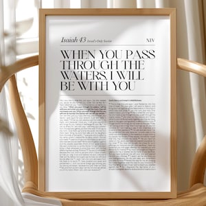 May include: A digital download printable featuring a black and white Bible verse from Isaiah 43:2, "When you pass through the waters, I will be with you." The verse is printed on a white background with a black frame.