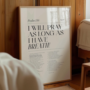 May include: A beige poster with a black frame and the text "Psalm 116 I WILL PRAY AS LONG AS I HAVE BREATH!" in large bold letters. The poster also includes the text "NLT" in the top right corner and a smaller section of text with verses from Psalm 116.