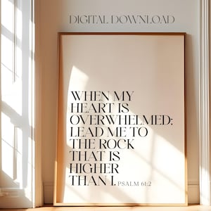 May include: A printable wall art print with a white background and black text. The text reads "When my heart is overwhelmed; lead me to the rock that is higher than I. Psalm 61:2"