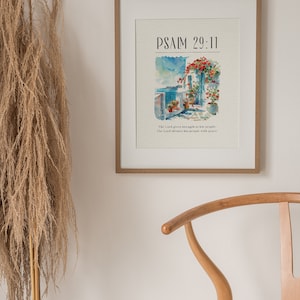 May include: A framed print with a watercolor painting of a building with flowers and the text "PSALM 29:11" and the quote "The Lord gives strength to his people. The Lord blesses his people with peace."