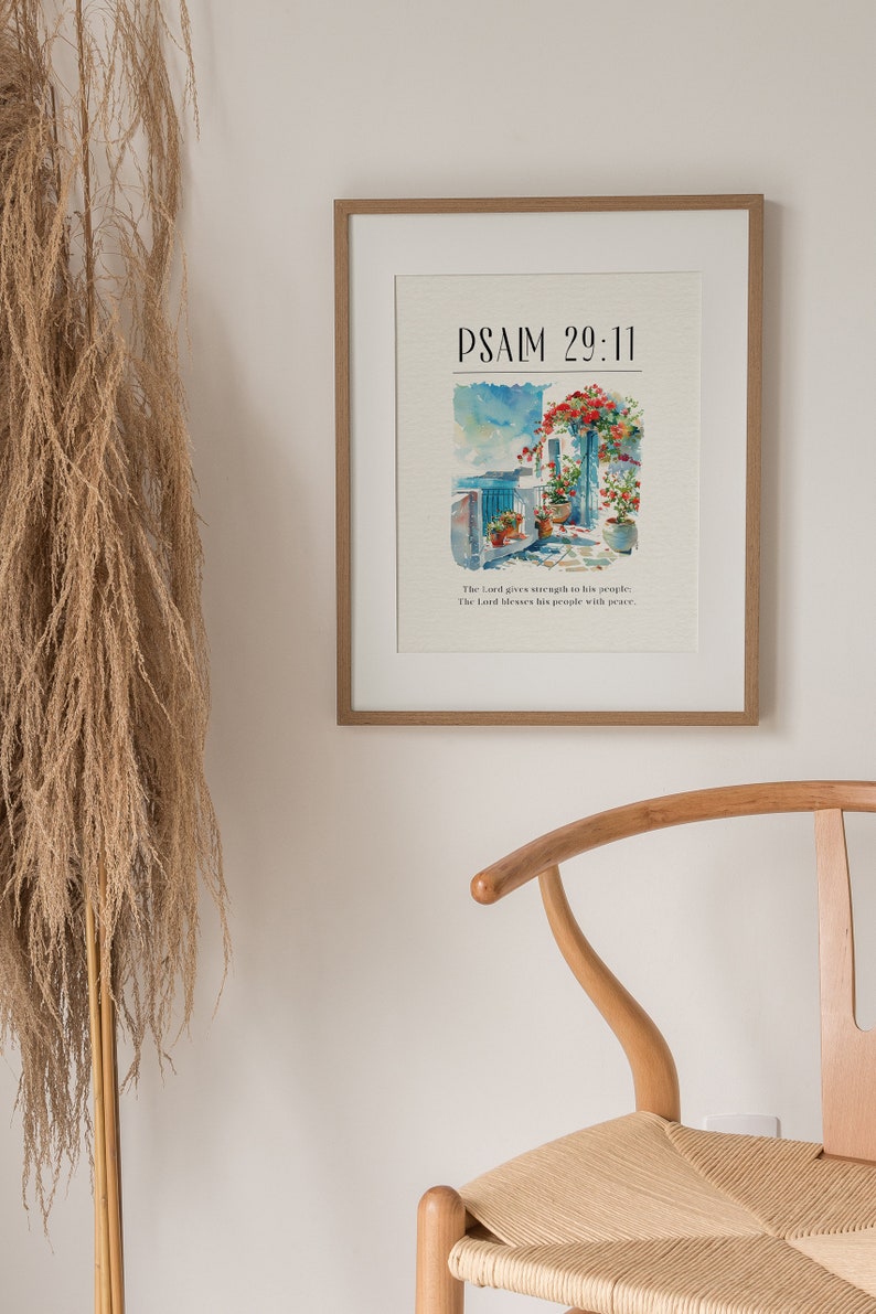 May include: A framed print with a watercolor painting of a building with flowers and the text "PSALM 29:11" and the quote "The Lord gives strength to his people. The Lord blesses his people with peace."