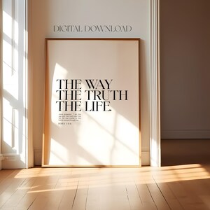 May include: A printable wall art design with a white background and black text that reads "The Way The Truth The Life."  The text is in a bold, sans-serif font.  The scripture reference "John 11:6" is printed below the text.