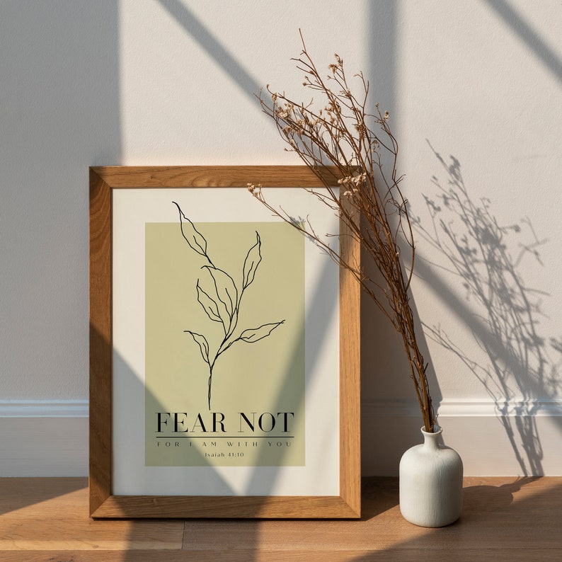May include: A framed print with a green background and a black line drawing of a plant. The text "FEAR NOT FOR I AM WITH YOU Isaiah 41:10" is printed below the plant.