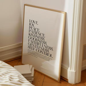 May include: A framed print with a white background and black text. The text is a list of words: Love, Joy, Peace, Patience, Kindness, Goodness, Faithfulness, Gentleness, Self-Control. The text is from Galatians 5:22-23.