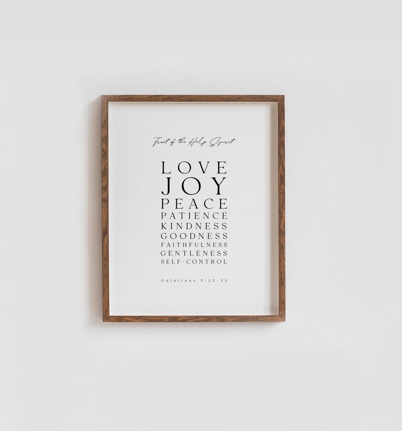 May include: A black and white printable wall art print with the text "Fruit of the Holy Spirit" and a list of the fruits of the Holy Spirit: Love, Joy, Peace, Patience, Kindness, Goodness, Faithfulness, Gentleness, Self-Control. The text "Galatians 5:22-23" is at the bottom of the print.