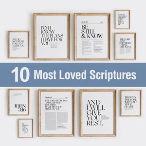 May include: A collection of ten framed art prints with inspirational quotes and Bible verses in black text on white backgrounds. The frames are light brown. The phrase "10 Most Loved Scriptures" is displayed in white text.