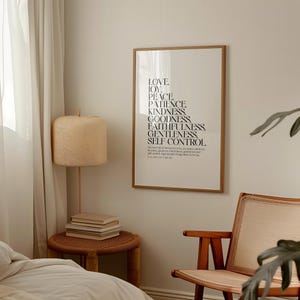 May include: A framed print with a white background and black text. The text reads "Love, Joy, Peace, Patience, Kindness, Goodness, Faithfulness, Gentleness, Self Control."