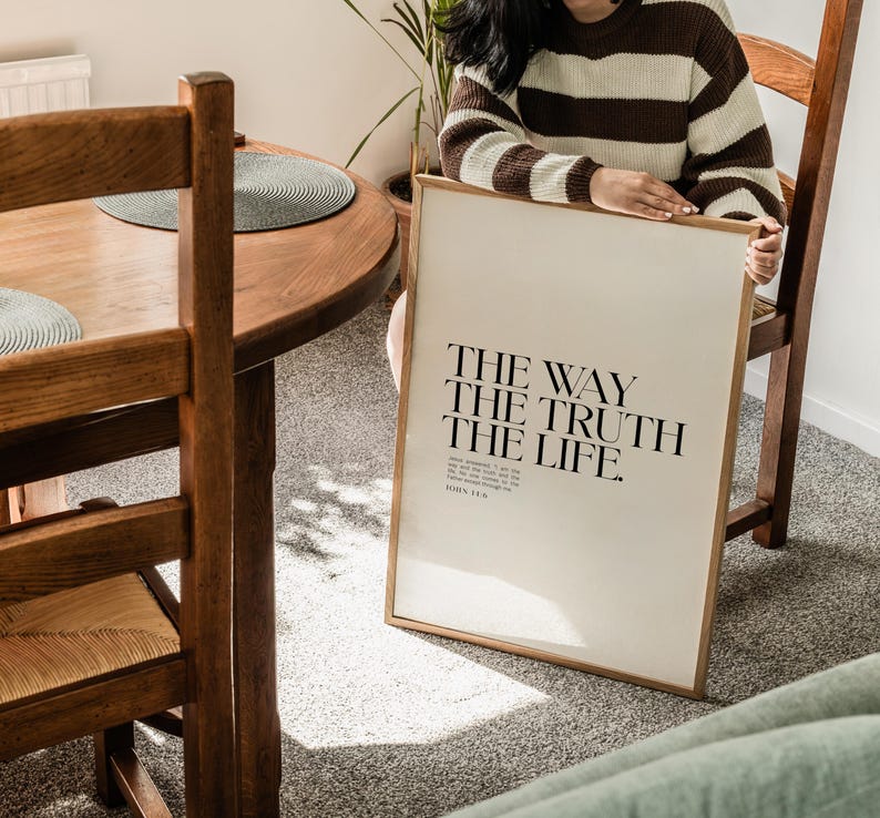 May include: A framed print with the text "THE WAY THE TRUTH THE LIFE." and the scripture reference "JOHN 14:6" in a minimalist black font on a white background.