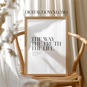 May include: A framed print with a white background and black text that reads "THE WAY THE TRUTH THE LIFE."  The text is in a bold, sans-serif font.  Below the text is a smaller font that reads "Jesus answered, 'I am the way and the truth and the life. No one comes to the Father except through me.'"  The text is followed by "JOHN 14:6".