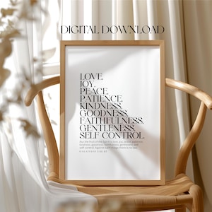May include: A black and white printable wall art print with a quote from the Bible, Galatians 5:22-23, about the fruit of the Spirit. The quote lists love, joy, peace, patience, kindness, goodness, faithfulness, gentleness, and self-control.