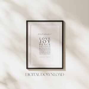 May include: A black and white printable wall art print with the text "Fruit of the Holy Spirit" and a list of the fruits of the Holy Spirit: Love, Joy, Peace, Patience, Kindness, Goodness, Faithfulness, Gentleness, Self-Control. The text "Galatians 5:22-23" is at the bottom of the print.
