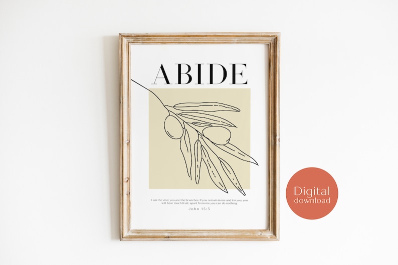 May include: A printable wall art print with a beige background and a black line drawing of an olive branch with the word "ABIDE" in black text at the top. The print also includes a bible verse from John 15:5.