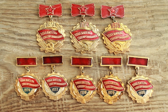 set of 8 Soviet Pins Winner of Socialist Competit