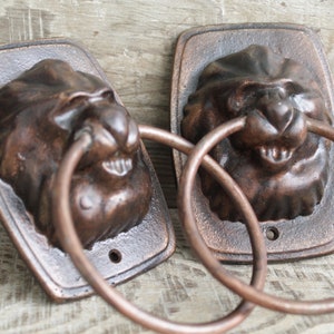 vintage Door Knobs, Vintage Metal Door Handles, In a bronze tone with a lions, mid-century door knob,  patina, cast iron home decor