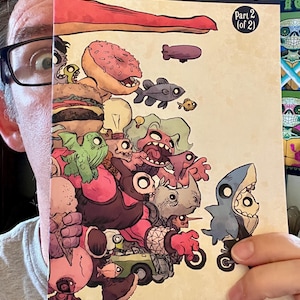 May include: A comic book titled Panda Delivery Service Part 2 (of 2) featuring a cream-colored cover with a dense, colorful illustration of various creatures, a donut, a burger, a lightbulb, and a shark-costumed character riding a small bicycle.