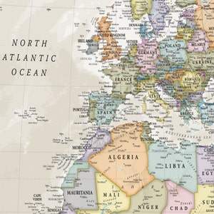 May include: A vintage-style world map with a muted color palette. The map features a detailed outline of the continents and countries, with major cities and geographical features labeled. The map is printed on a cream-colored background.