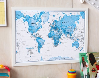 May include: A white framed world map with blue continents and white oceans. The map is titled "The World" and includes the names of major countries and oceans.