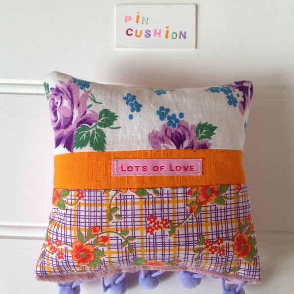 Pin cushion, vintage fabric patchwork. Purple flowers, orange flowers. Ready to send