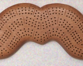A custom cribbage board for that guy with the handlebar mustache in your life