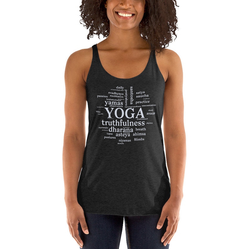 May include: A dark heather grey tank top with a white word cloud design that says "YOGA" in large letters and includes words like "truthfulness", "dharana", "asteya", and "ahimsa".