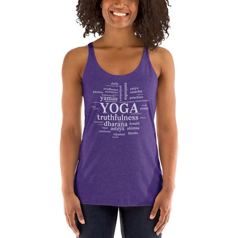 May include: Purple tank top with a white word cloud design that includes the word "yoga" and other related terms like "truthfulness", "dharana", and "ahimsa".