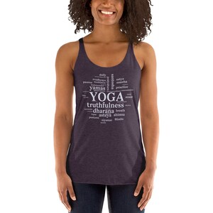 May include: A purple tank top with a white word cloud design that includes the word "yoga" and other related terms like "truthfulness", "dharana", and "asteya".