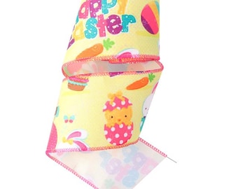 May include: Yellow ribbon featuring an Easter-themed design. The ribbon displays the words "Happy Easter" in various colours, alongside illustrations of carrots, chicks, Easter eggs, and bunnies. The edges of the ribbon are stitched in pink.
