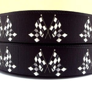 May include: Black and white checkered racing flags printed on black ribbon. The ribbon is 1 inch wide and is perfect for adding a sporty touch to crafts and gifts.