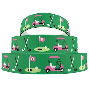 May include: Three rolls of green and white ribbon with a pink golf cart, golf clubs, and a golf flag design.