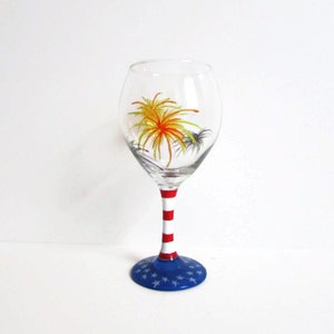 Hand painted wine glass fourth of July labor day memorial day fireworks flag patriotic glass red white and blue custom glass