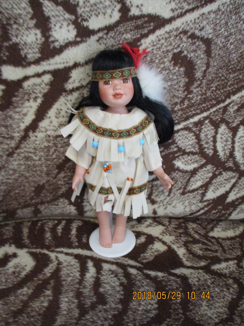 11 Inch All Porcelain Native American Maiden-Red Feather-by image 0