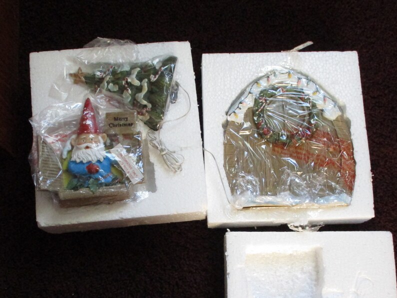 Travelocity 3 Piece Solar Christmas Gnome Doorstop Set in image 0