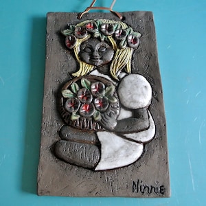 Swedish retro vintage 1960s larger rectangular ceramic wall plaque with multicolor girl with flower boquet/ wreath motive, signed Ninnie