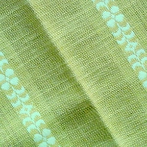 May include: Green fabric with a white and brown patterned stripe.