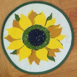 Swedish retro vintage 1970s round printed cotton/synthetic design tablet with yellow/ brown/ olivegreen sunflower motive on bonewhite bottom