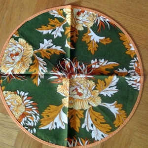 Swedish retro vintage 1970s round printed cotton fabric design tablet with multicolor pion  flower motive on olivegreen bottom